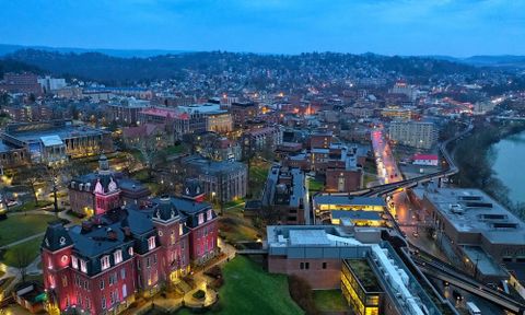 Bird's eye view of downtown campus lit up at dusk