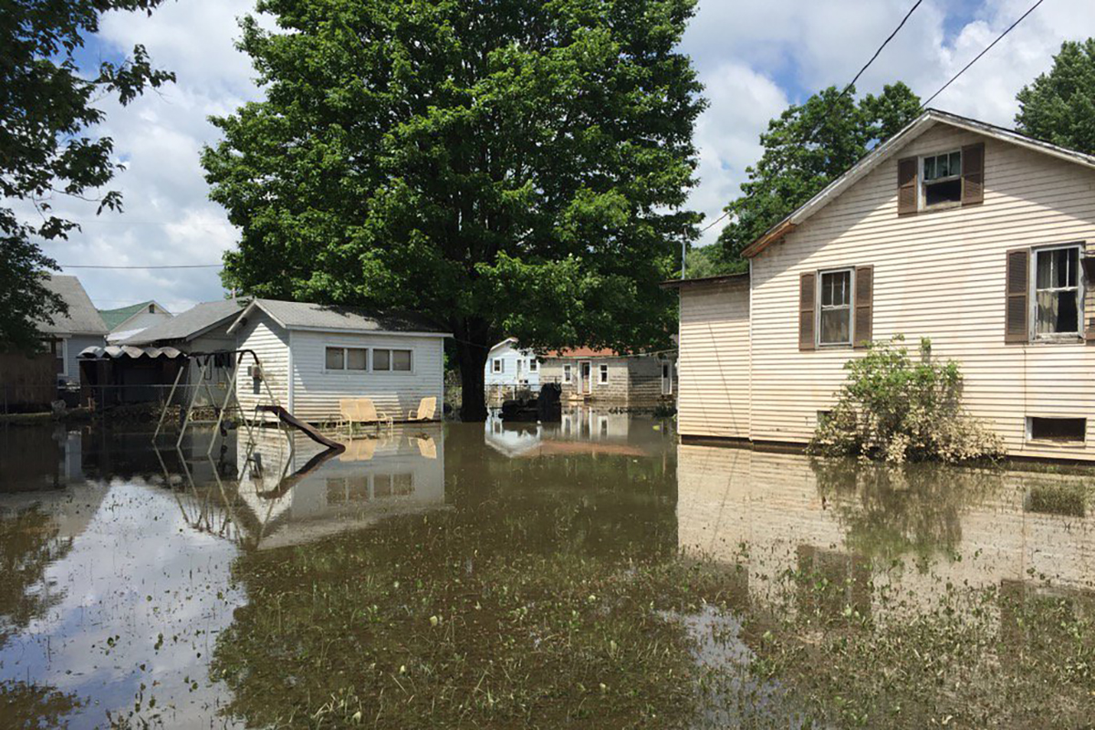 Flooded yard with a swingset